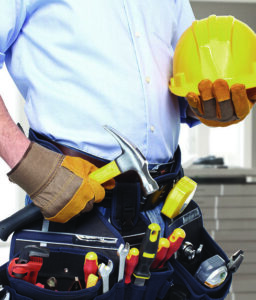 Man with utility belt and hard hat